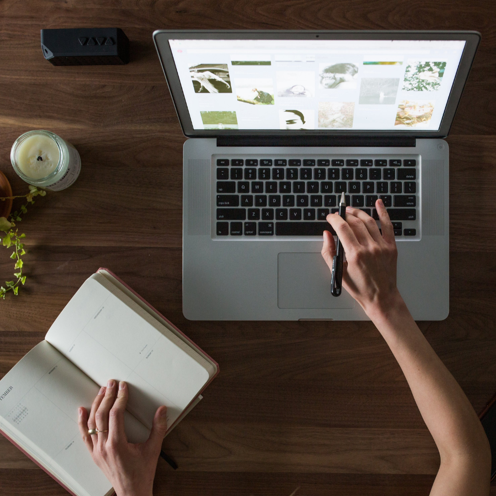 Employees using Andersen Learning Management System on laptop